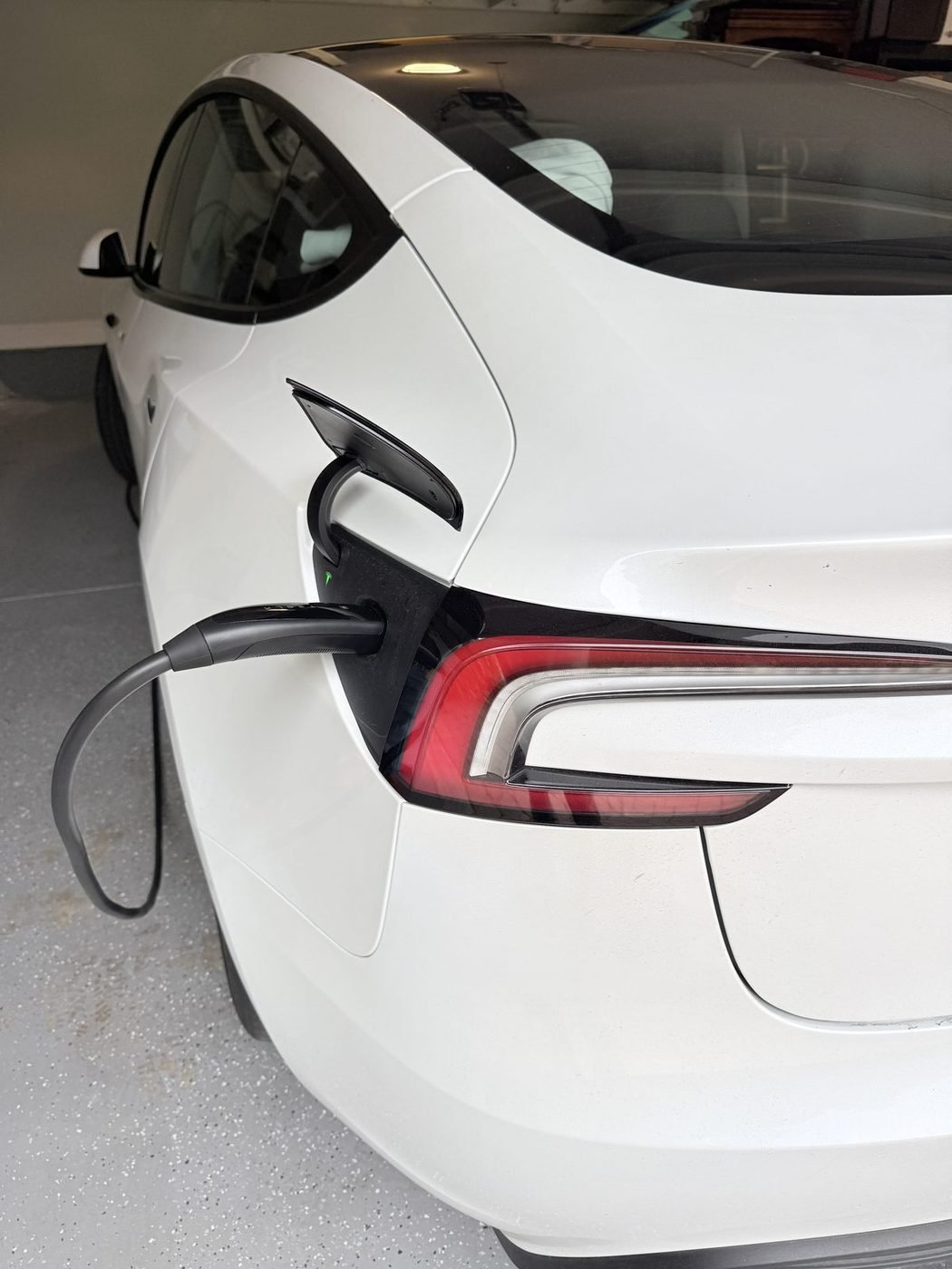 Tesla Model 3 charging from a Tesla Wall Connector installed by Pure Power Electrical in Pablo Creek Reserve, Jacksonville, FL