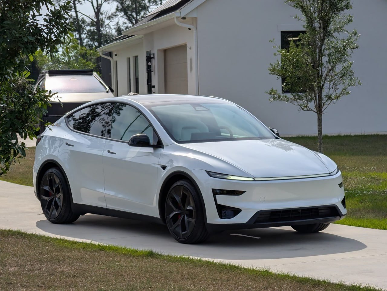 Tesla Model Y at a customer home with a Level 2 EV charger installed by Pure Power Electrical