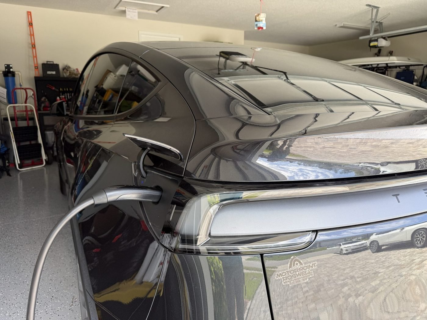 Tesla Model Y charging from a Level 2 EV charger installed by Pure Power Electrical in Deep Creek Landing, Nocatee, FL